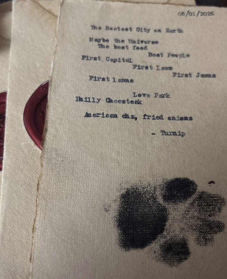 A hand-typed poem with Roo's paw print
